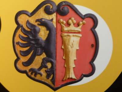 The coat of arms of the Bryggen Office representing king cod and half the Lubeck eagle